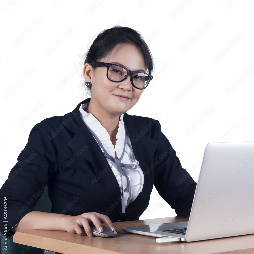 Portrait of confident business woman sitting at the table and wo Portrait of confident business woman sitting at the table and wo