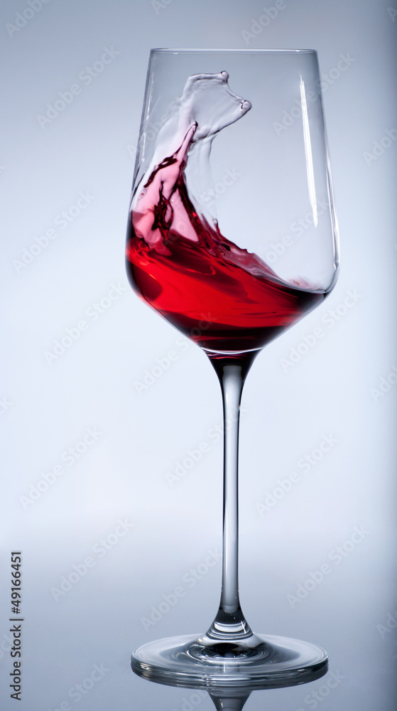 Red wine splashing in the elegant glass. Clipping path Red wine splashing in the elegant glass. Clipping path