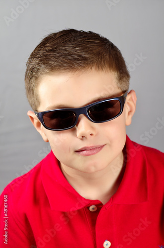 serious child with sunglasses
