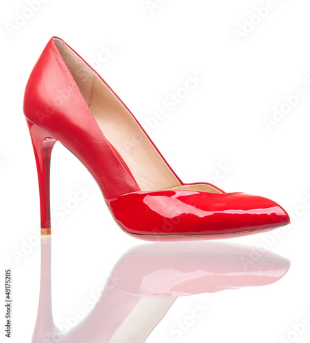 Red female shoe over white background