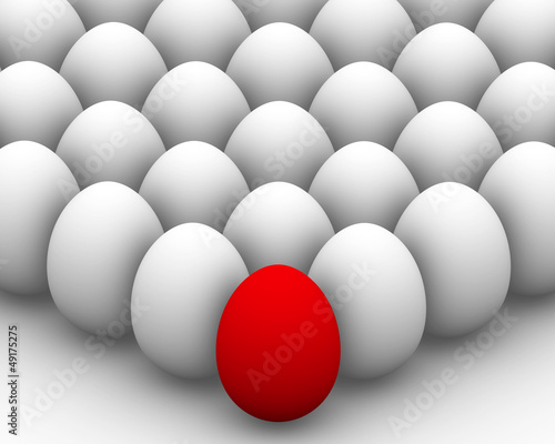 White eggs with one red egg in front