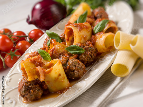 paccheri pasta with meatballs, selective focus