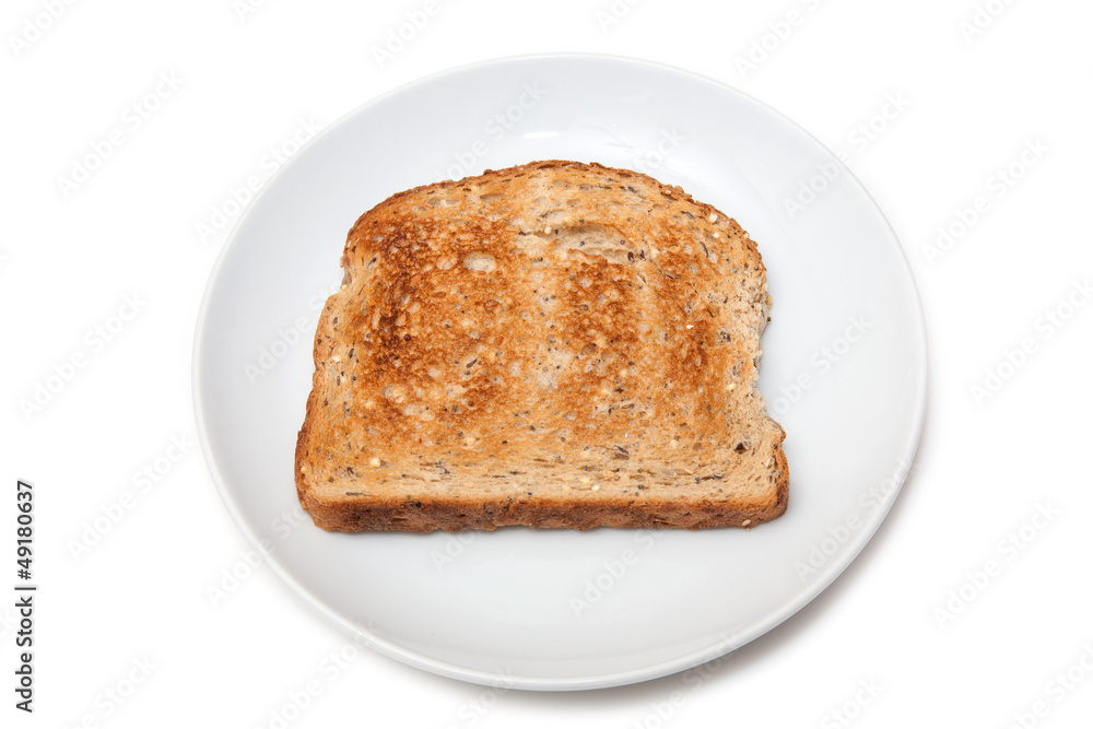Plate of wholemeal toast isolated on a white studio background.