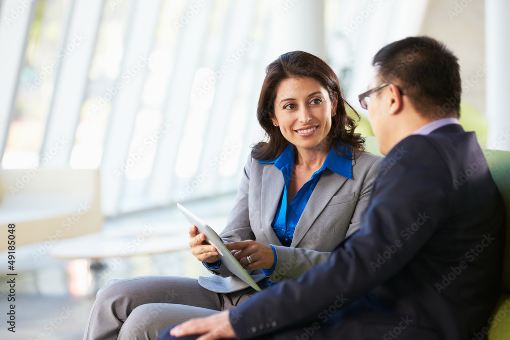 Business people With Digital Tablet Sitting In Modern Office Business people With Digital Tablet Sitting In Modern Office