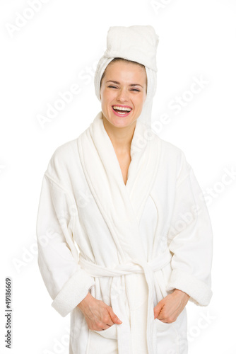 Portrait of smiling young woman in bathrobe