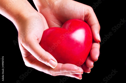 Heart on the palm as love and health symbol
