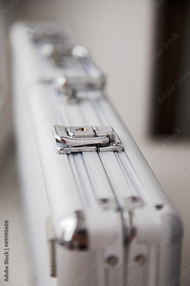 Silver locked metal briefcase Silver locked metal briefcase