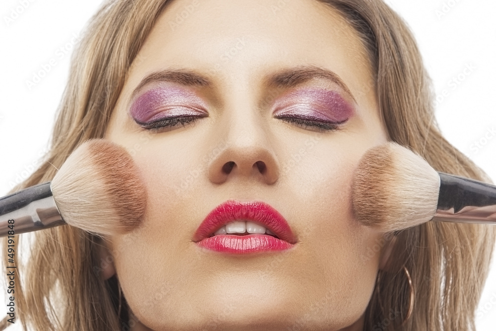 portrait of beautiful woman with brushes for make-up portrait of beautiful woman with brushes for make-up