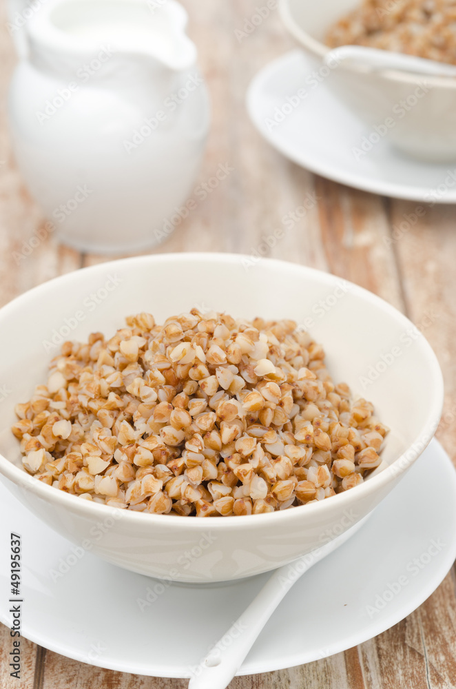 Boiled buckwheat in a white bowl Boiled buckwheat in a white bowl
