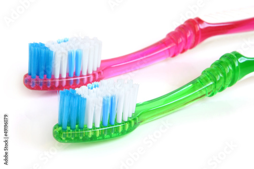 Two colorful tooth-brushes