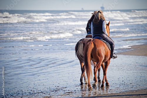 Fototapeta Naklejka Na Ścianę i Meble -  Riding Horses on the Beach