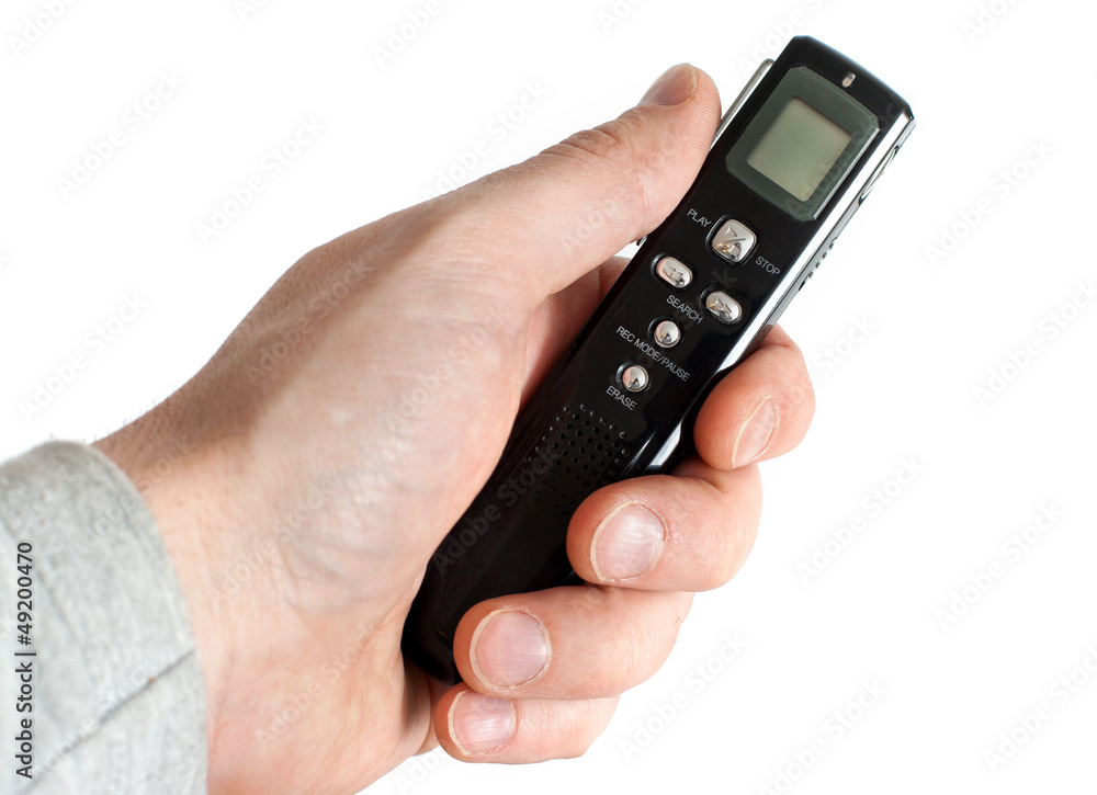 Male hand holding Audio Recorder using for documenting sound Male hand holding Audio Recorder using for documenting sound