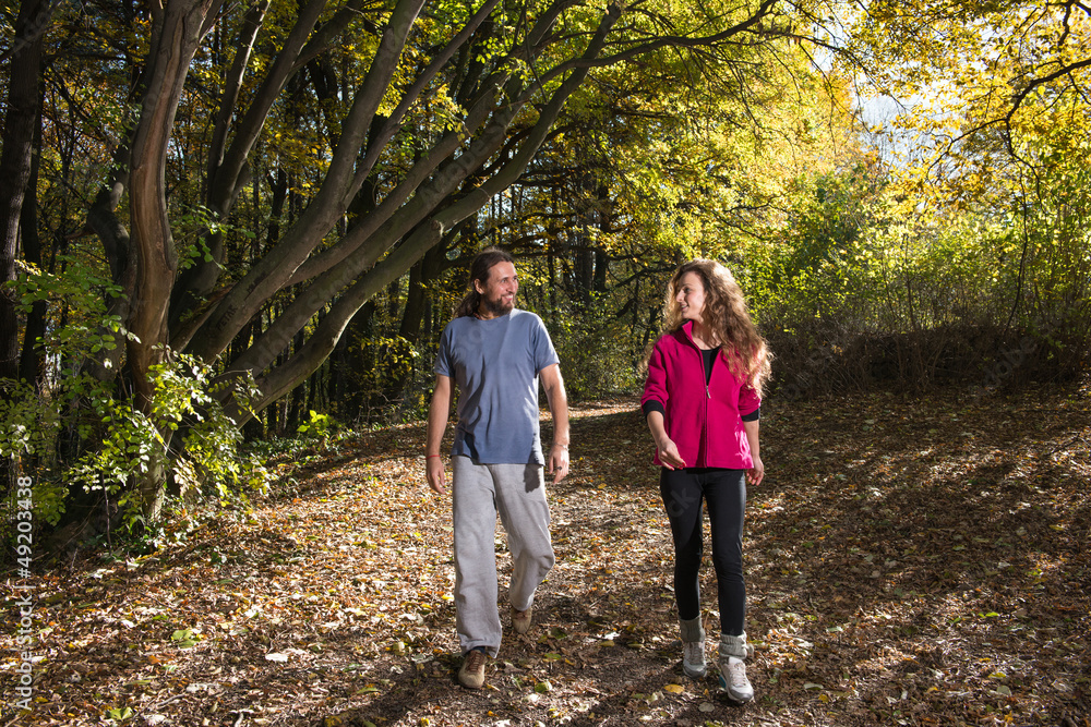 pair walking trough woods pair walking trough woods