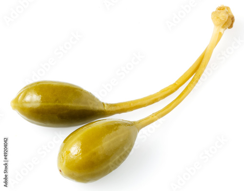 Photos Close-up shot of two marinated capers  isolated on white