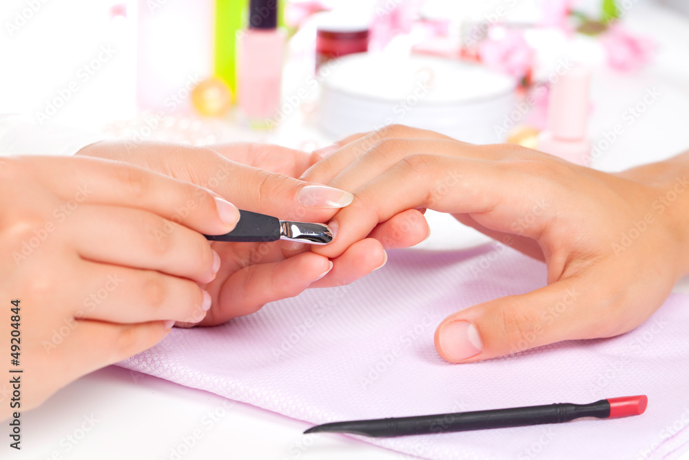 Fototapeta premium Manicure. Care of fingers of hands, cleaning, covering a varnish