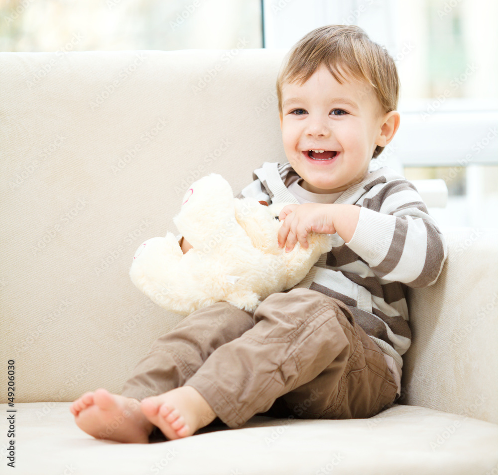 Portrait of a little boy with his teddy bear Portrait of a little boy with his teddy bear