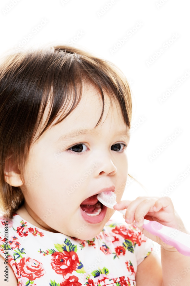 Child brushes teeth