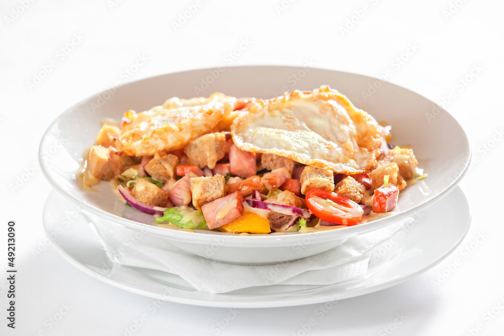 salad with vegetables, bacon and fried eggs salad with vegetables, bacon and fried eggs