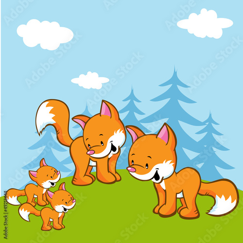 fox family on meadow near the forest
