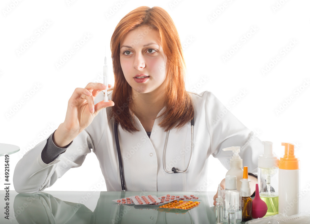 Woman doctor holding a syringe Woman doctor holding a syringe