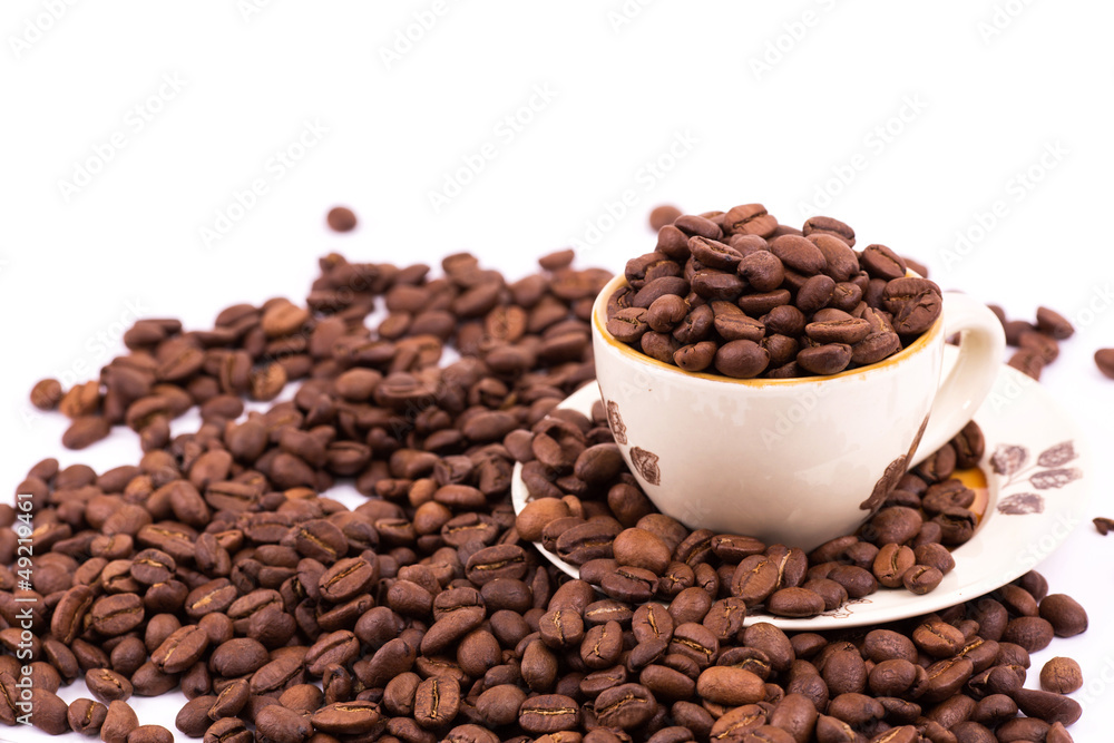 Coffee beans and cup of coffee background Coffee beans and cup of coffee background