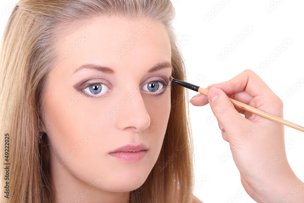 attractive girl with make-up brush over white attractive girl with make-up brush over white