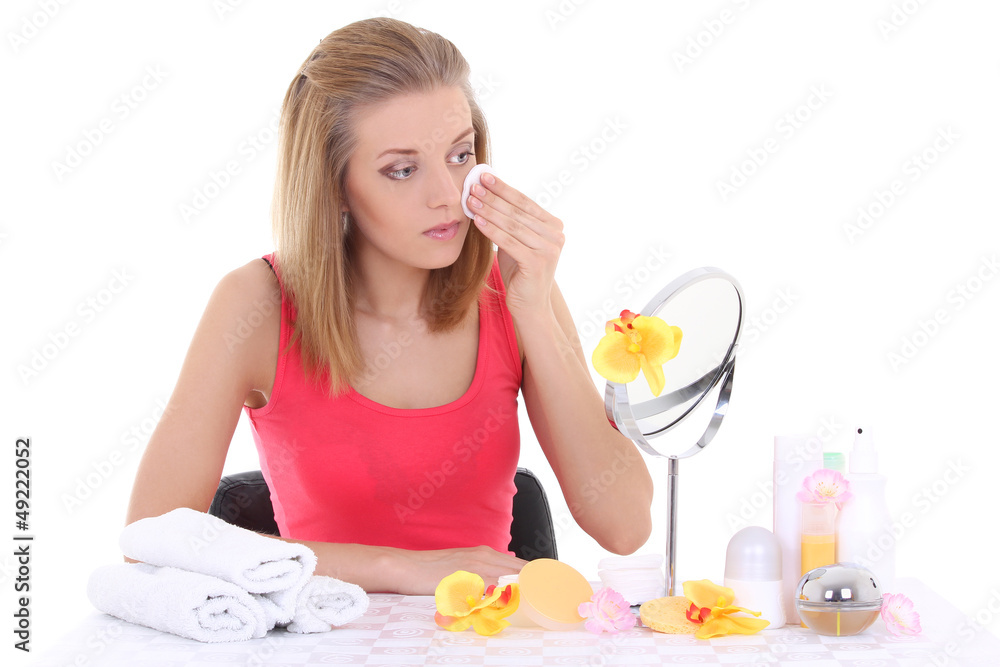 girl sitting at table with make up accessories and mirror girl sitting at table with make up accessories and mirror