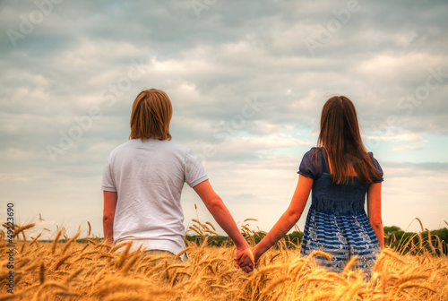 Couple staying at a wheat field