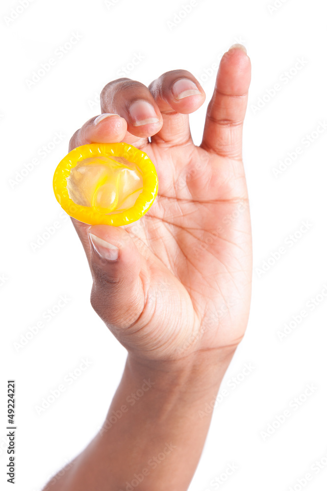 Safe sex concept. African woman Hand with condom