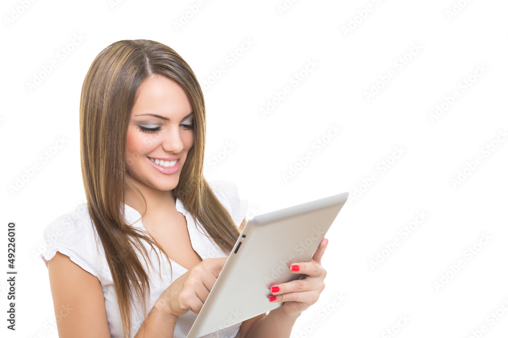Blonde businesswoman smiling and working on tablet computer Blonde businesswoman smiling and working on tablet computer