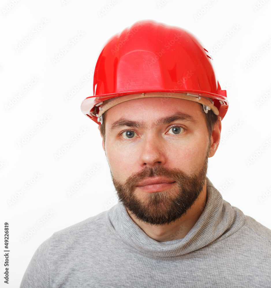 Construction worker in a red helmet. Construction worker in a red helmet.