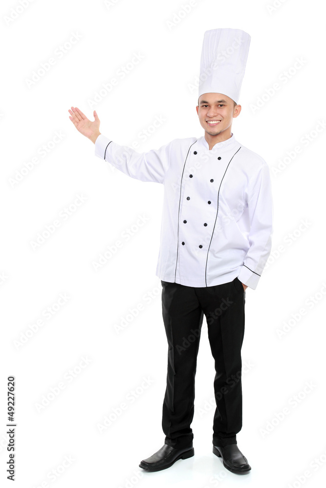 male chef smiling presenting blank space