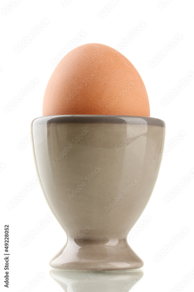 Whole boiled egg in egg cup, isolated on white Whole boiled egg in egg cup, isolated on white