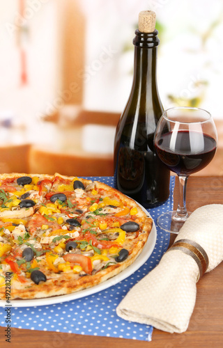 Tasty pizza with wine