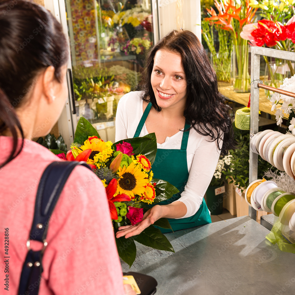 Obraz premium colorful bouquet florist woman selling customer flower