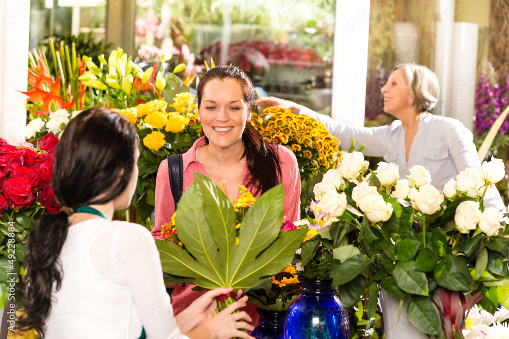 Young woman buying bouquet flower shop customer