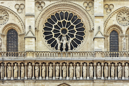 Rose shaped window in front of gothic Notre Dame