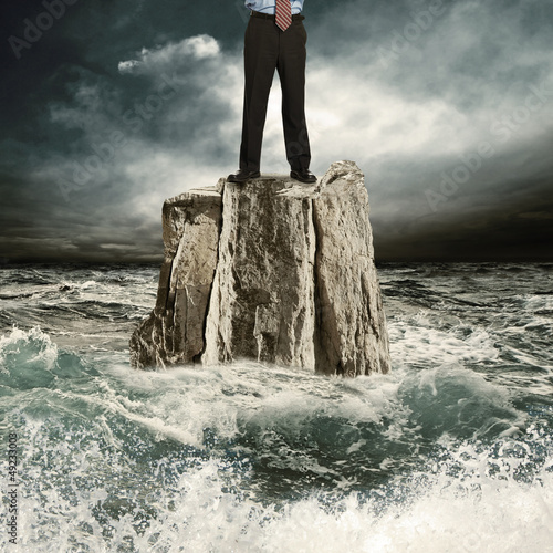Standing on the rock in the sea