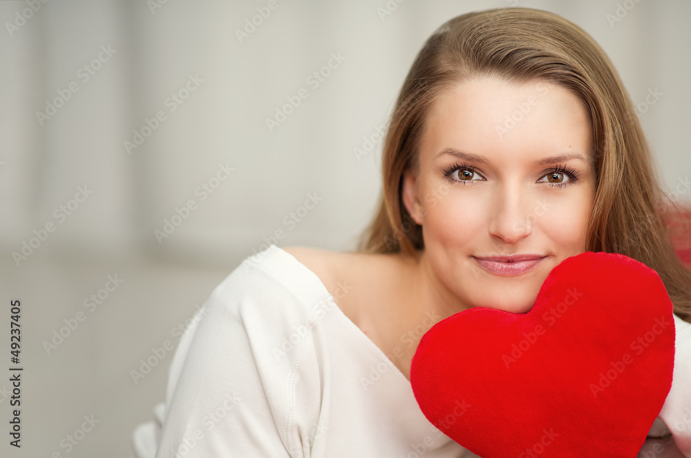 Woman in love with heart in hand - portrait for Valentines Day Woman in love with heart in hand - portrait for Valentines Day