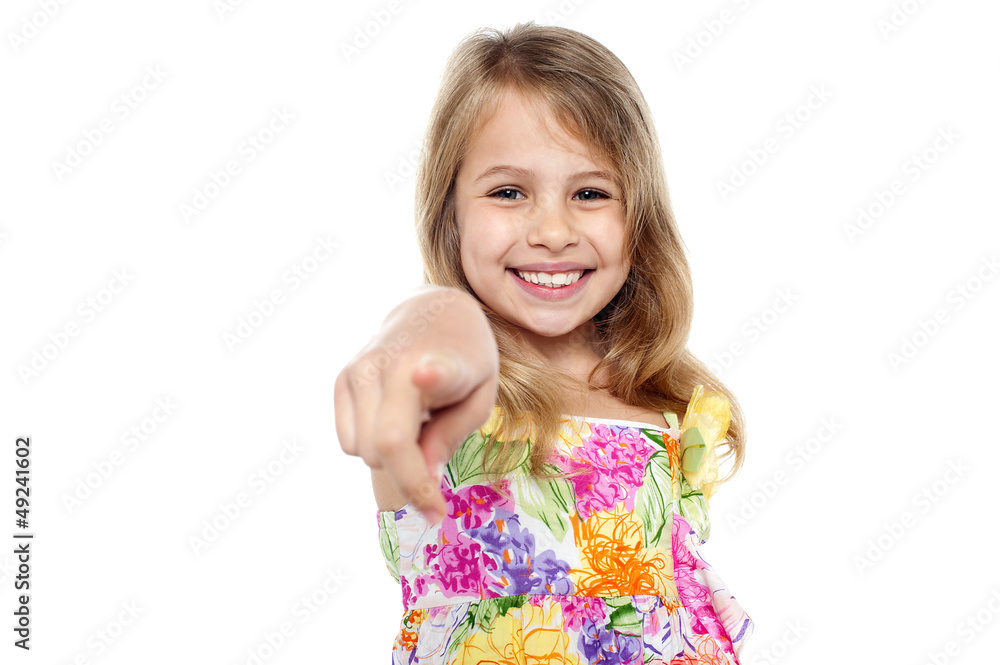 Portrait of a cheerful kid pointing towards you Portrait of a cheerful kid pointing towards you