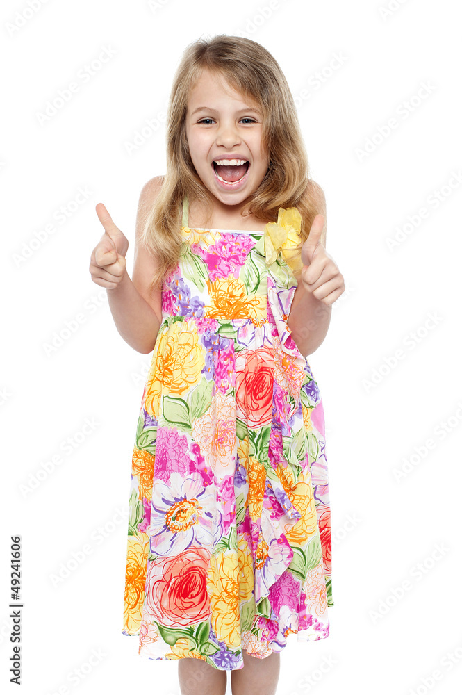 Excited young girl showing double thumbs up Excited young girl showing double thumbs up
