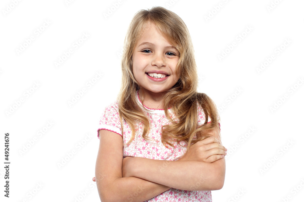 Cute young girl posing with hands crossed Cute young girl posing with hands crossed