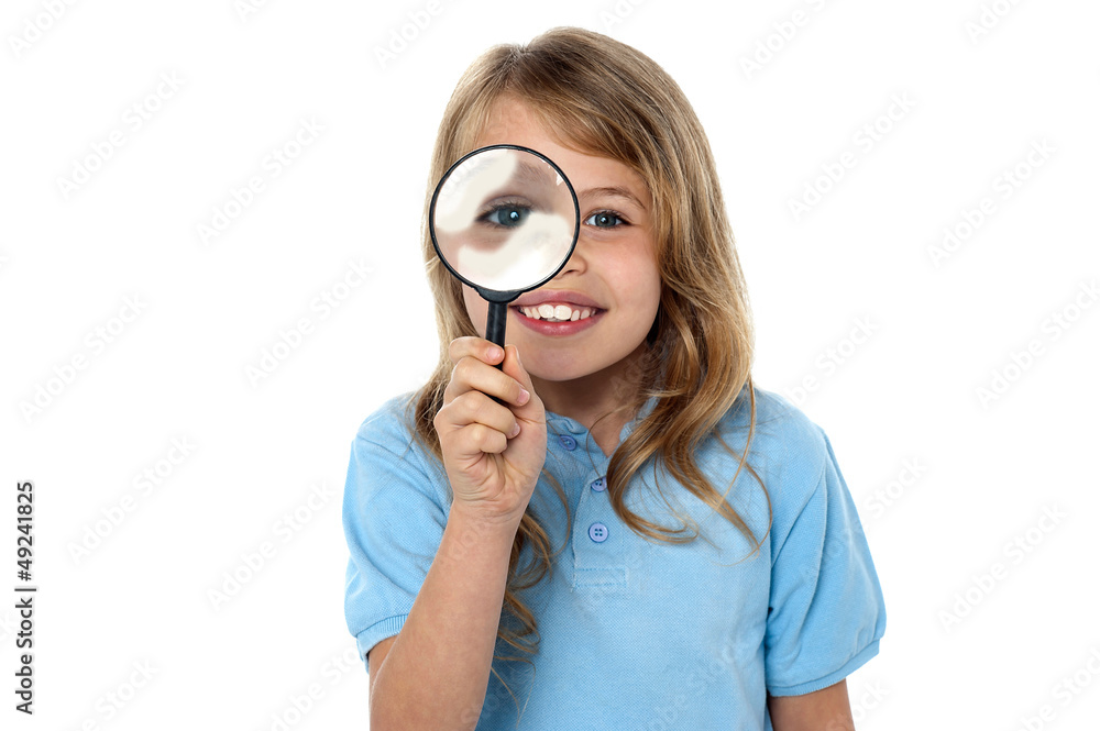 Smiling kid with magnifying glass Smiling kid with magnifying glass