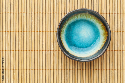 empty bowl and bamboo mat