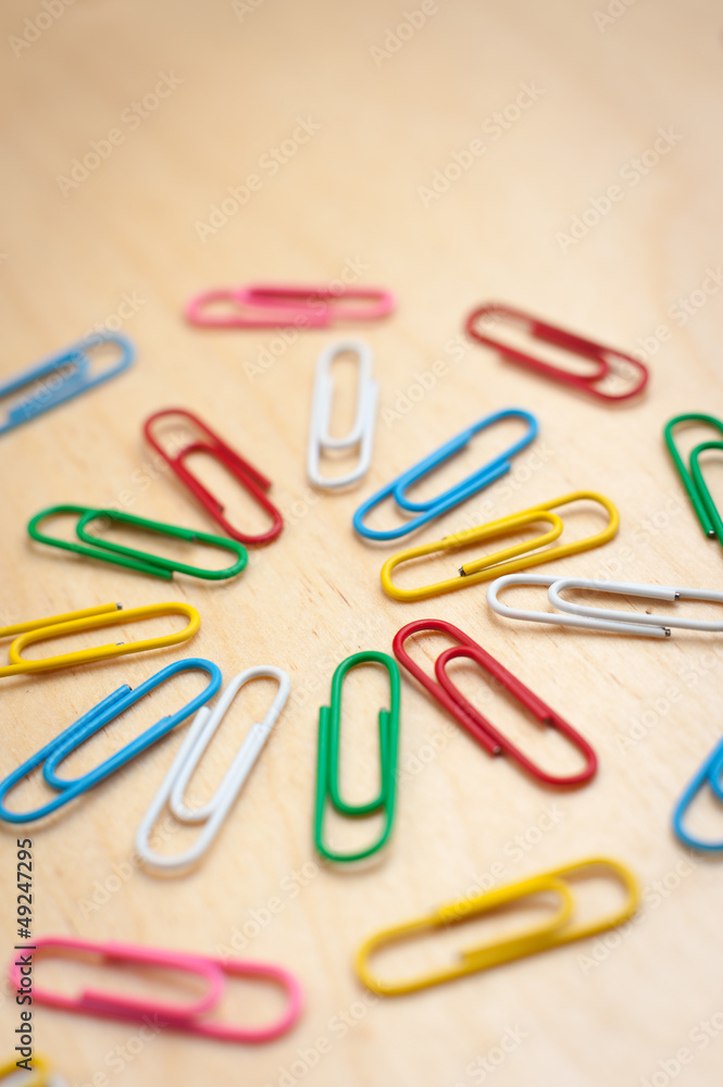 Paper Clips on Wooden Table in Round Paper Clips on Wooden Table in Round