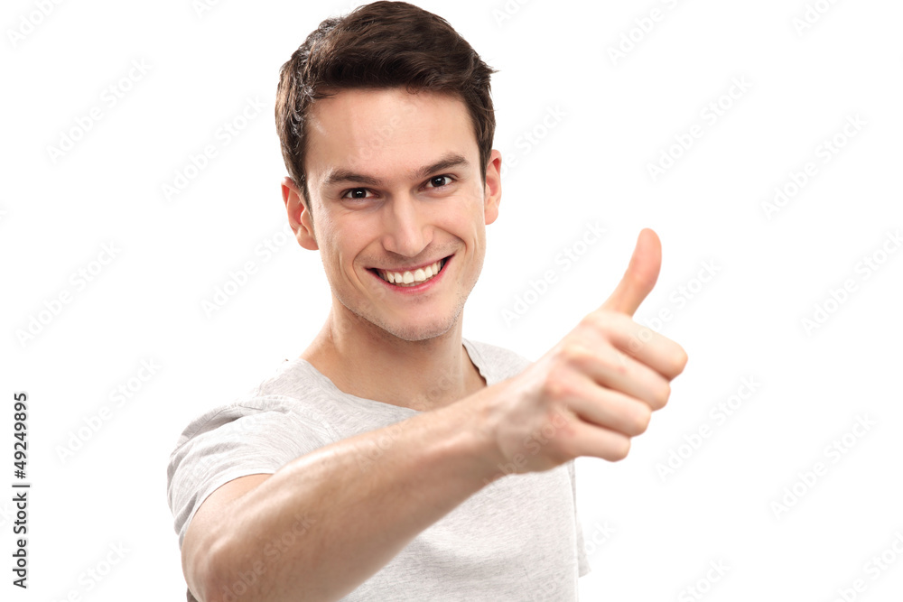 Young man showing thumbs up