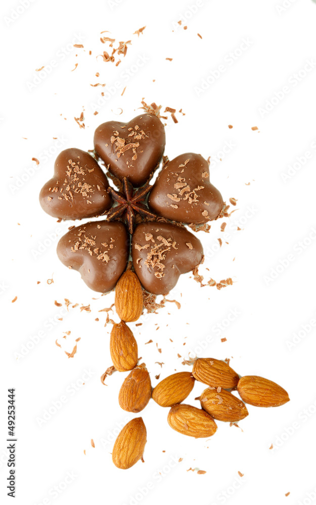 Fototapeta premium Chocolate hearts, almonds isolated on white
