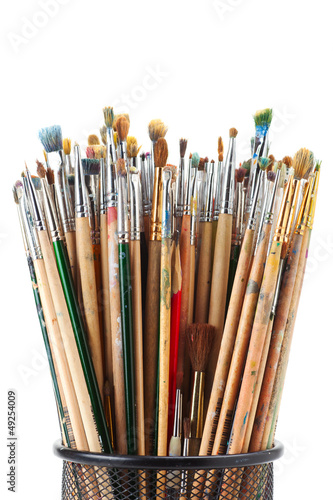 paintbrushes in black holder cup