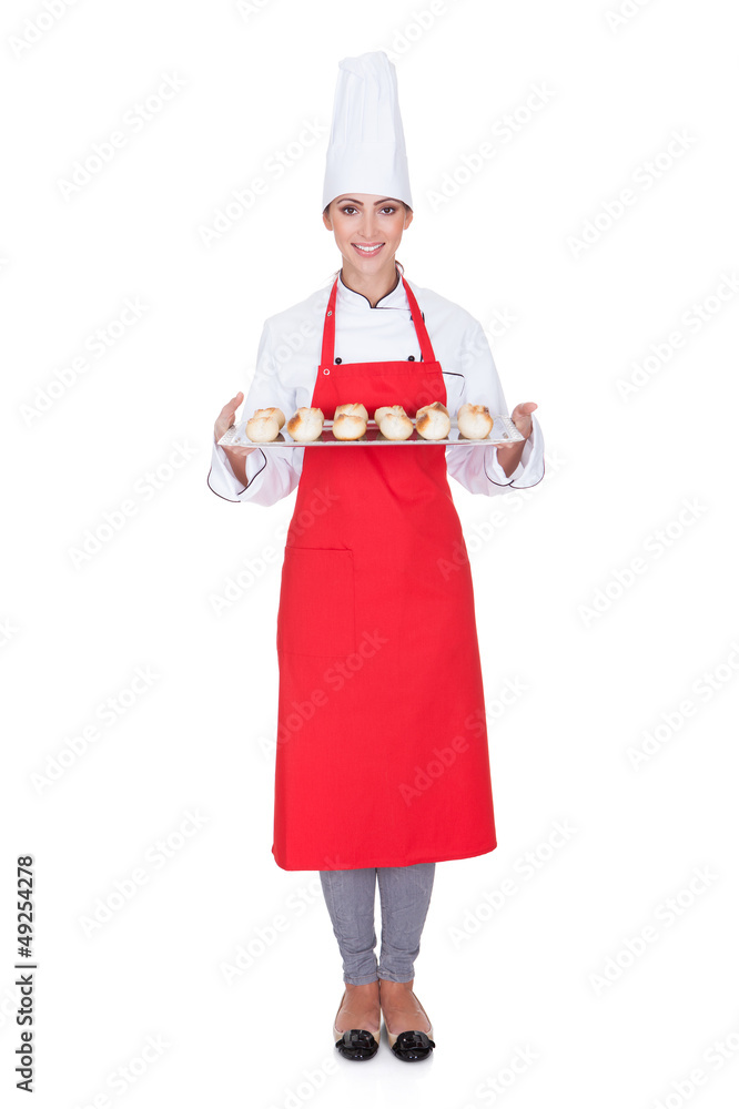 Female Baker Holding Fresh Bread