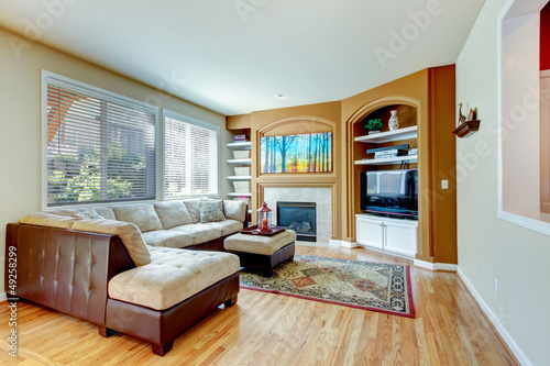 Living room with fireplace and hardwood floor.